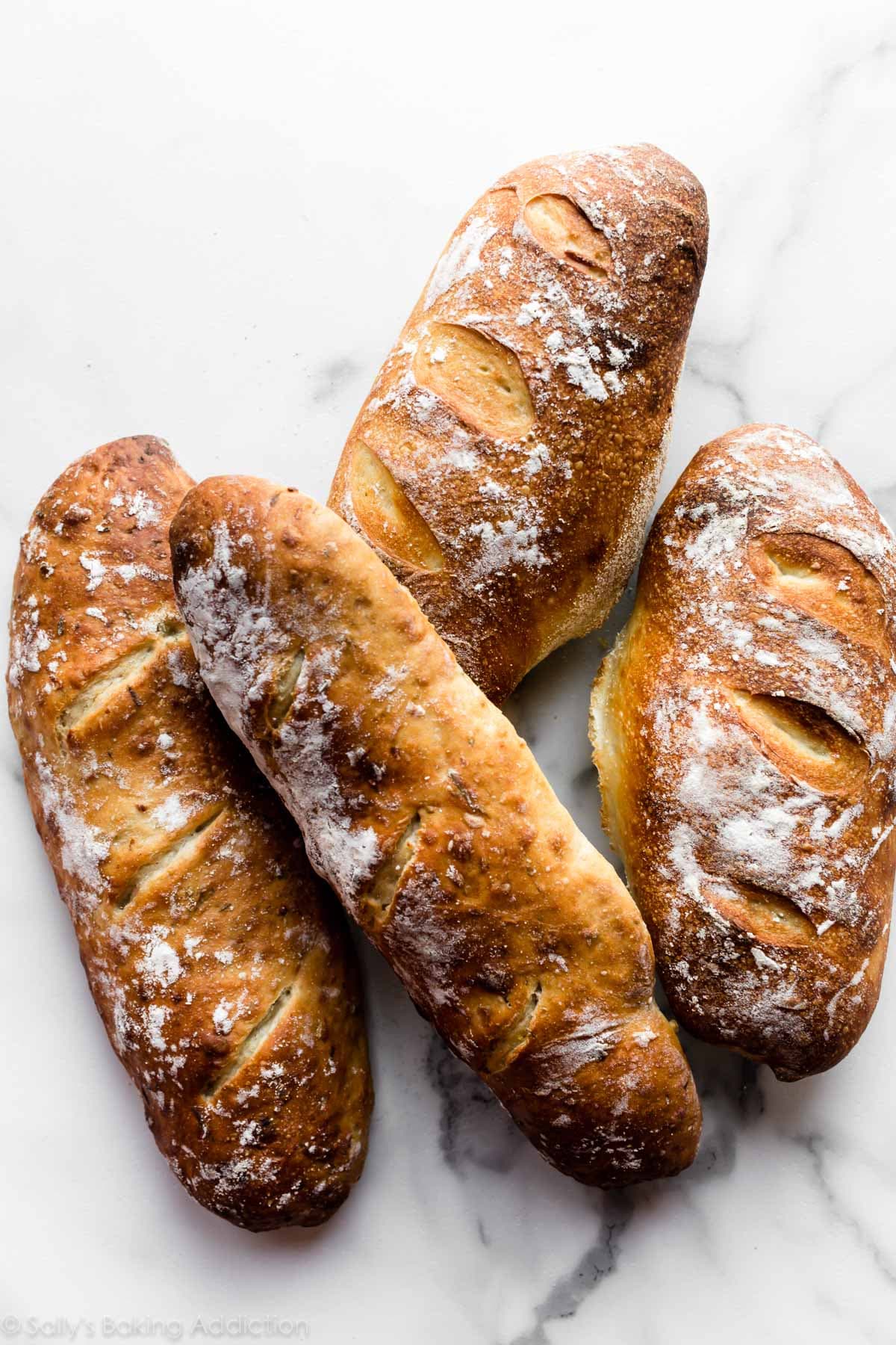Rustic flour-dusted artisan bread loaves