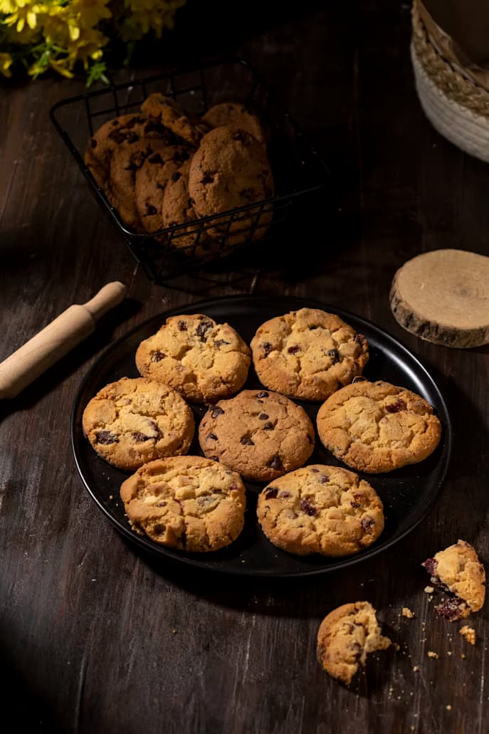 Freshly baked chocolate chip cookies in a baking tray
