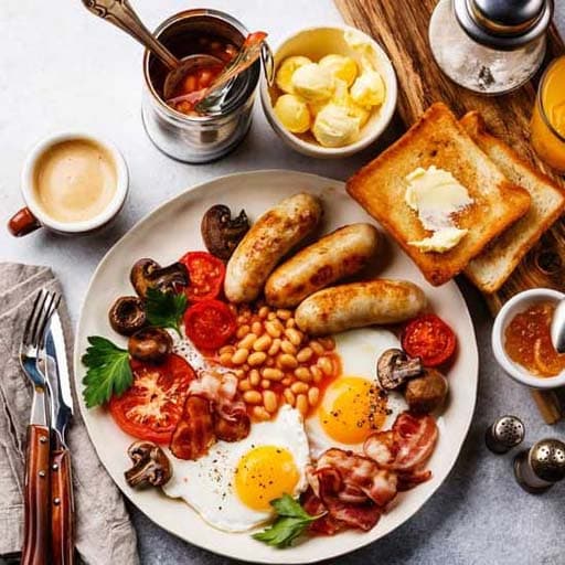 A generous café breakfast served with coffee, toast and fresh accompaniments